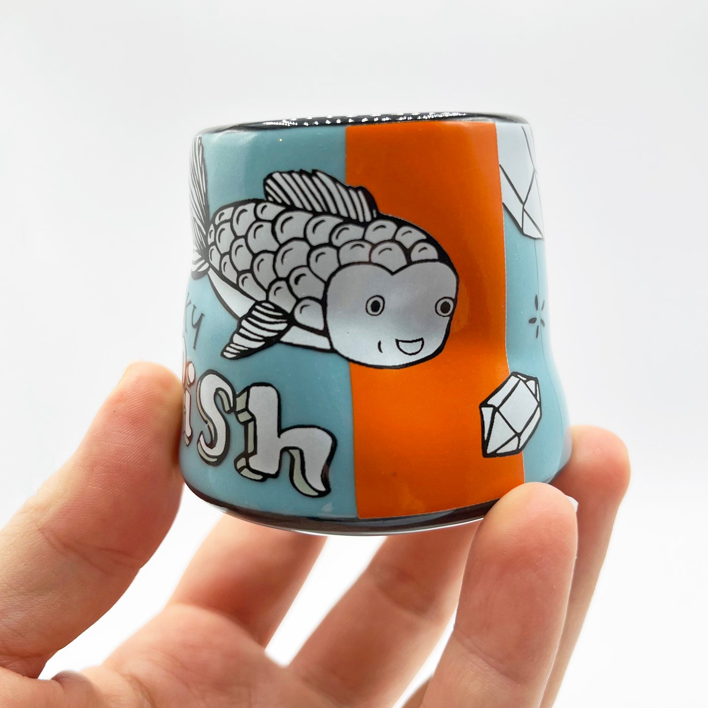 goldfish cup held against a white background