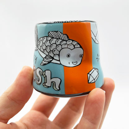 goldfish cup held against a white background